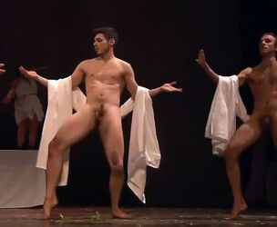 Softcore display in the Roman style, dudes unwrap on stage.