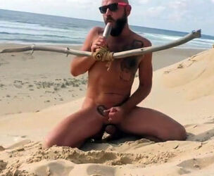 boy tears up himself on the beach with a wooden faux-cock