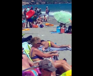 Spotted a lady wanking on a public beach